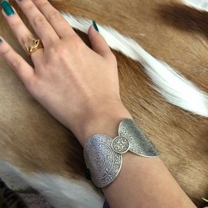 Silver coin bracelet.